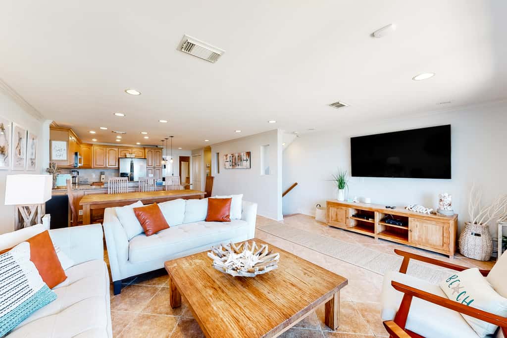 Three-Story Beachfront Gem with a Private Balcony, Ocean View, & Full Kitchen