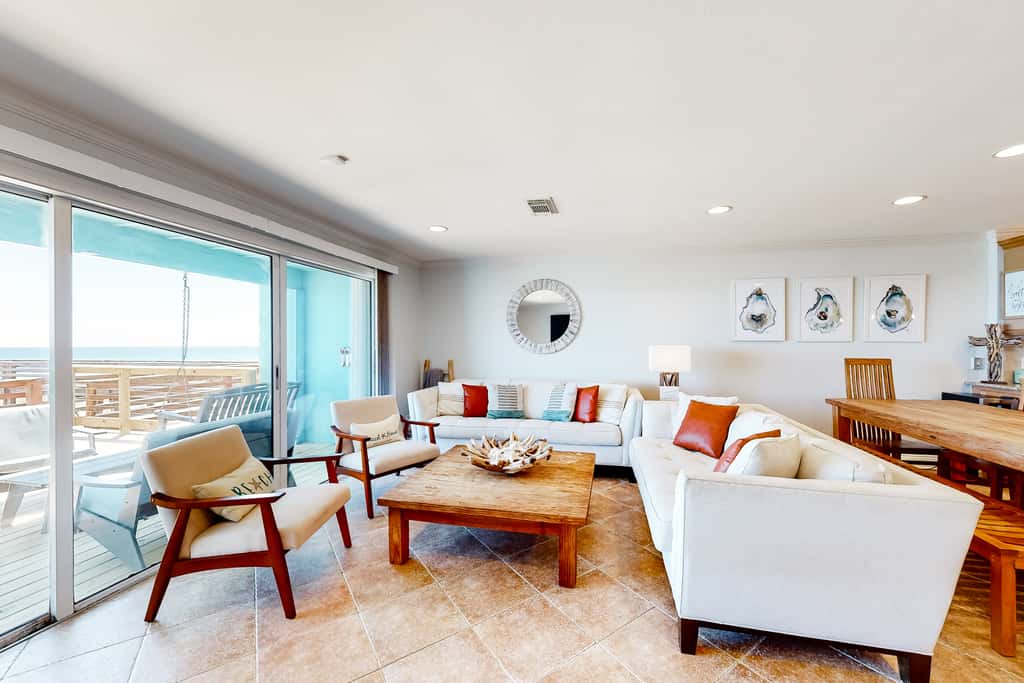 Three-Story Beachfront Gem with a Private Balcony, Ocean View, & Full Kitchen