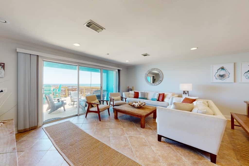 Three-Story Beachfront Gem with a Private Balcony, Ocean View, & Full Kitchen