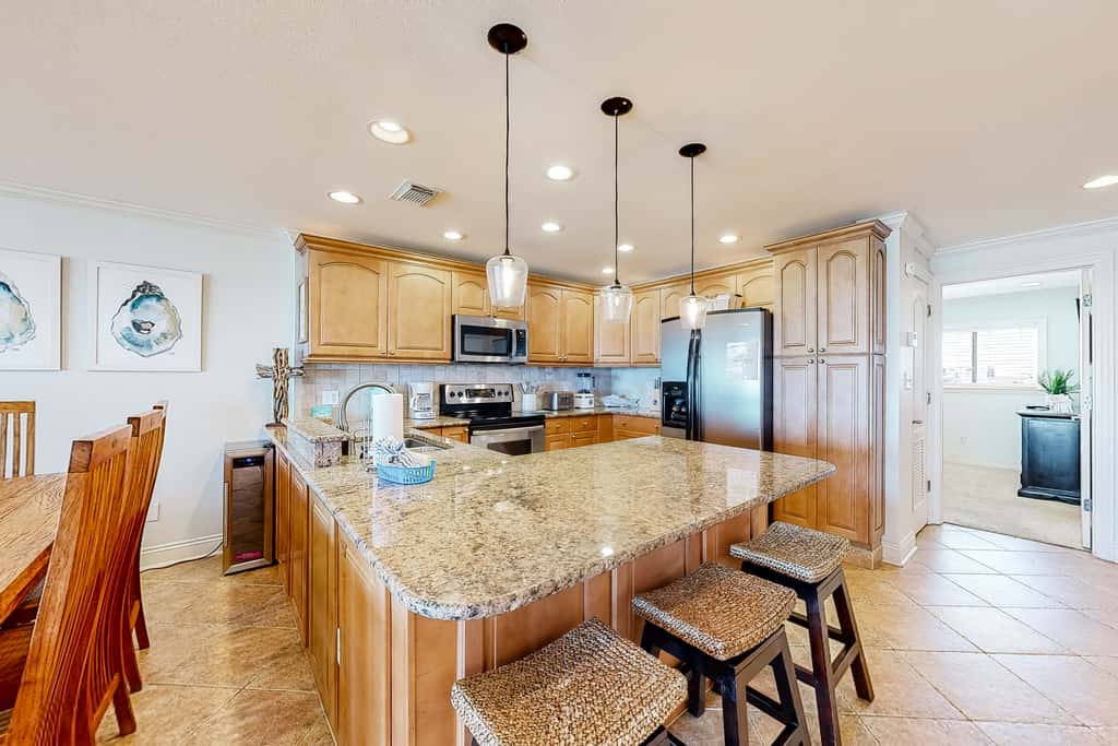 Three-Story Beachfront Gem with a Private Balcony, Ocean View, & Full Kitchen