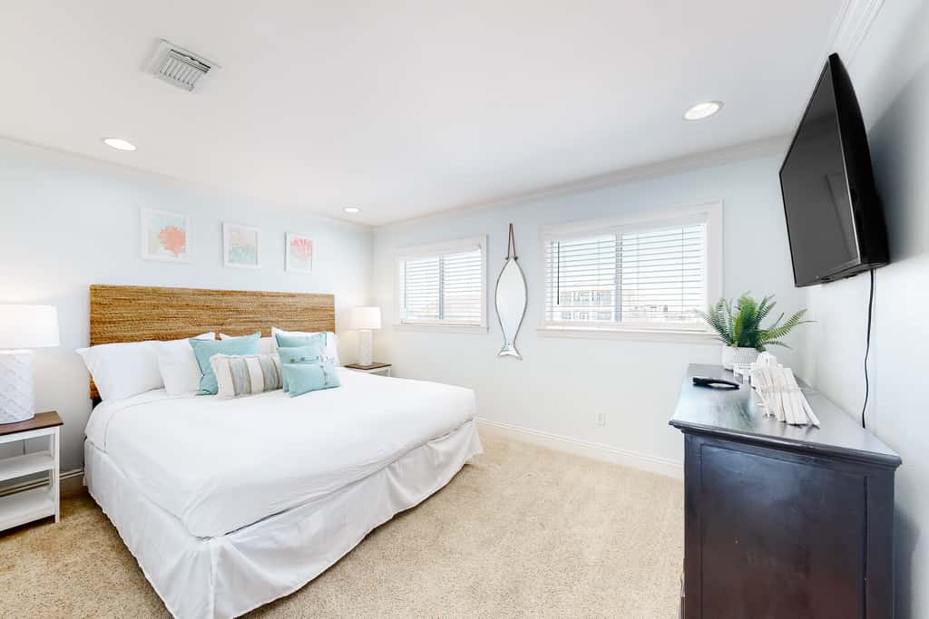 Three-Story Beachfront Gem with a Private Balcony, Ocean View, & Full Kitchen