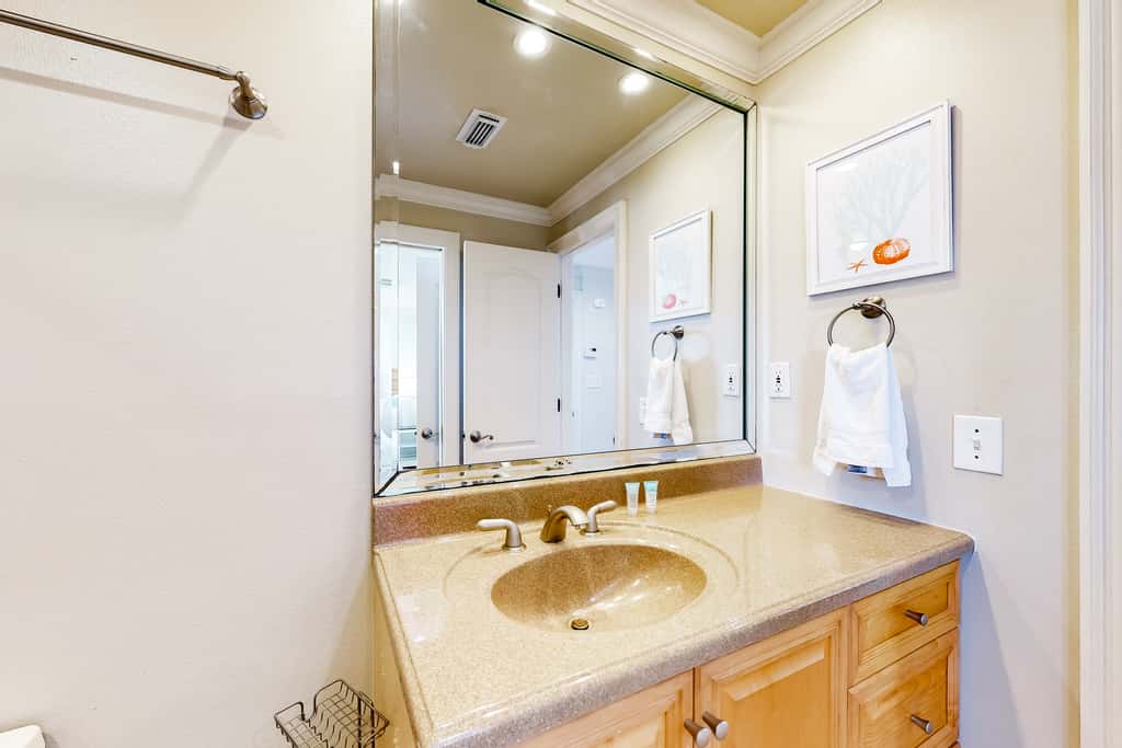 Three-Story Beachfront Gem with a Private Balcony, Ocean View, & Full Kitchen
