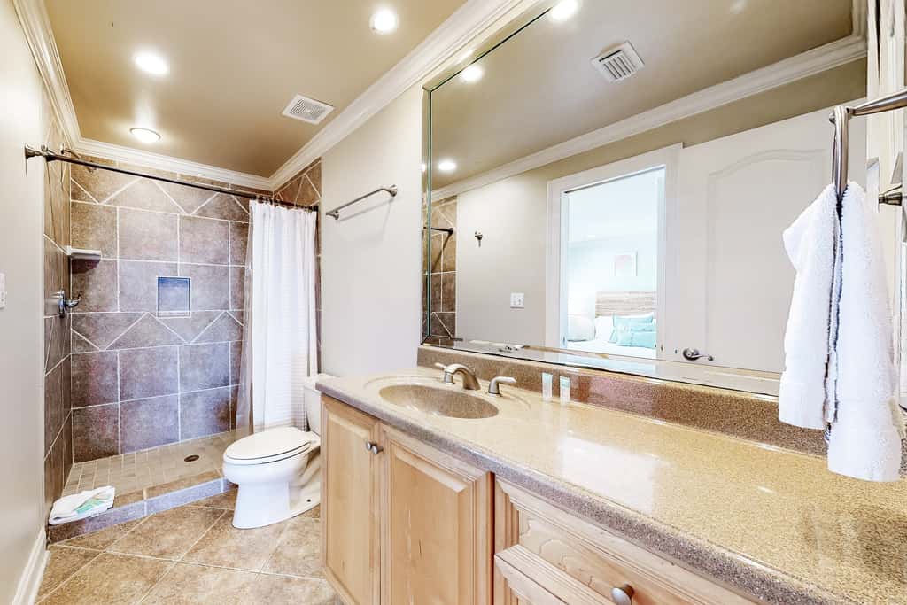 Three-Story Beachfront Gem with a Private Balcony, Ocean View, & Full Kitchen