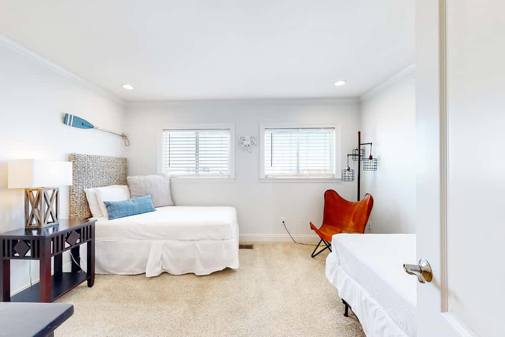 Three-Story Beachfront Gem with a Private Balcony, Ocean View, & Full Kitchen