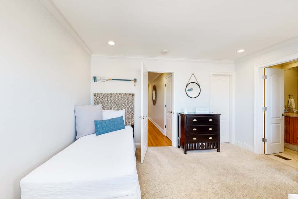 Three-Story Beachfront Gem with a Private Balcony, Ocean View, & Full Kitchen