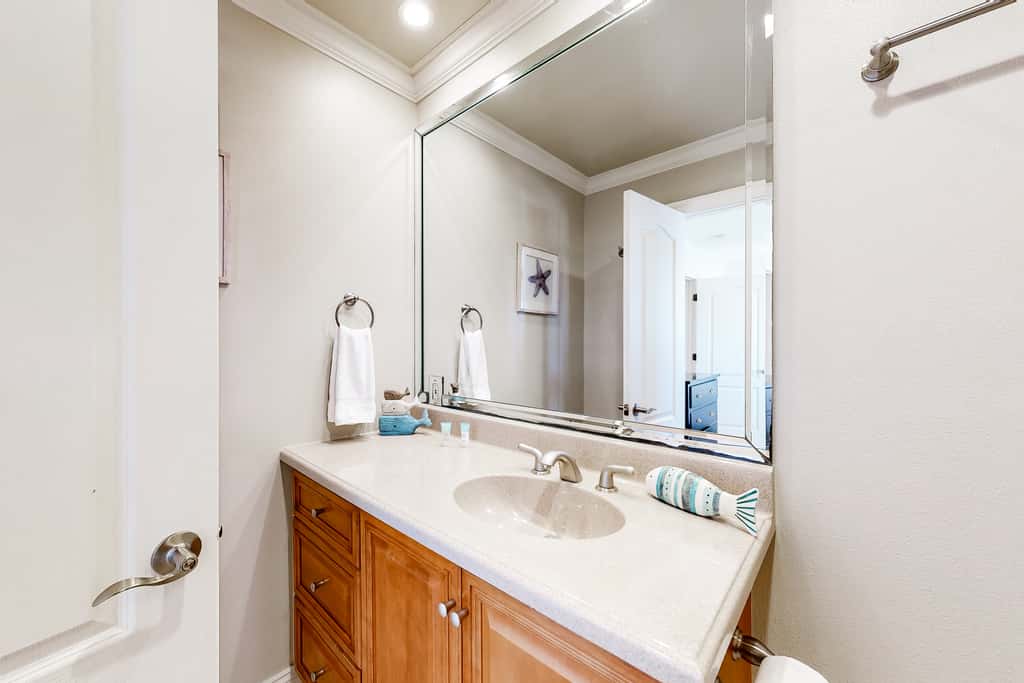 Three-Story Beachfront Gem with a Private Balcony, Ocean View, & Full Kitchen
