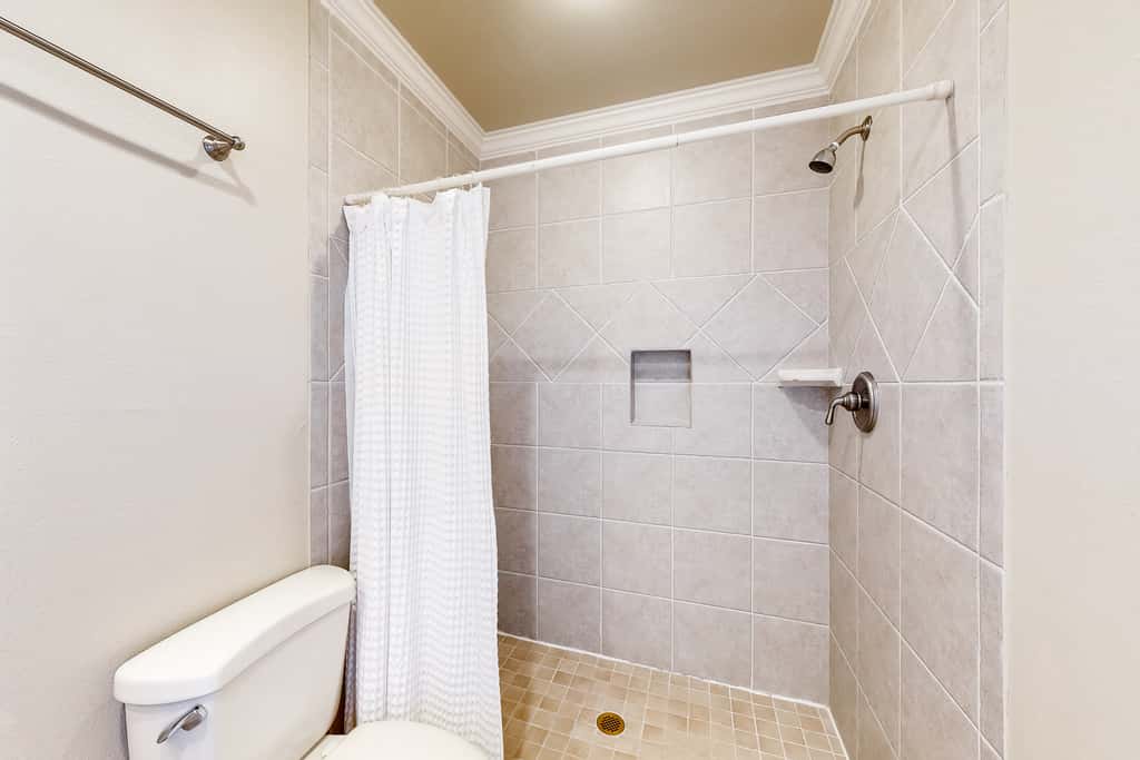 Three-Story Beachfront Gem with a Private Balcony, Ocean View, & Full Kitchen