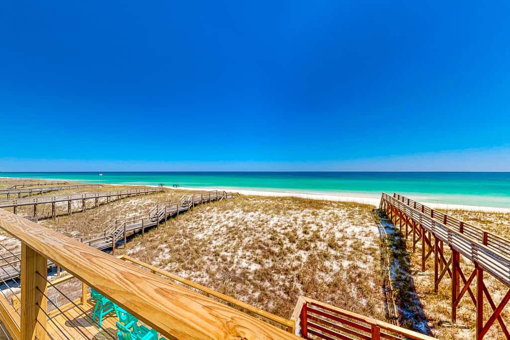 Three-Story Beachfront Gem with a Private Balcony, Ocean View, & Full Kitchen
