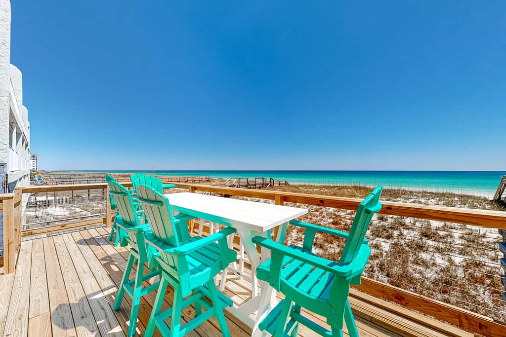 Three-Story Beachfront Gem with a Private Balcony, Ocean View, & Full Kitchen