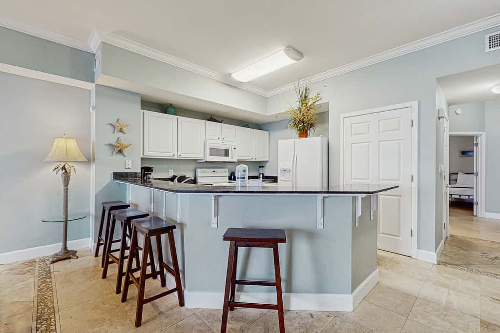 Escape to this waterfront condo with shared pools, a gym, & easy beach access