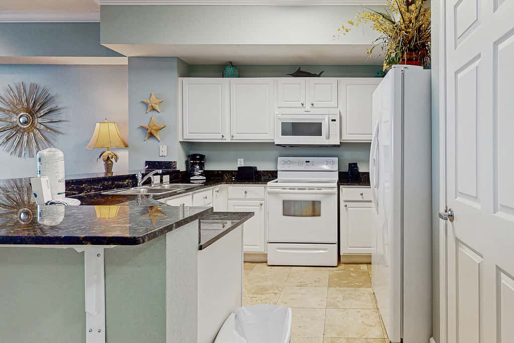 Escape to this waterfront condo with shared pools, a gym, & easy beach access