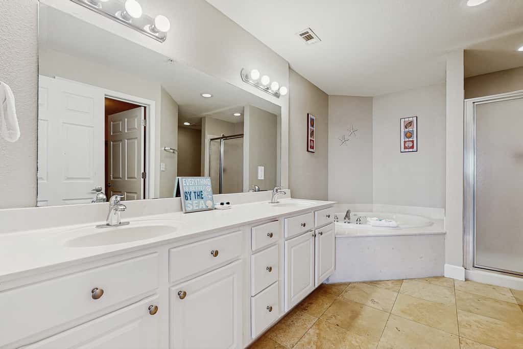 Escape to this waterfront condo with shared pools, a gym, & easy beach access