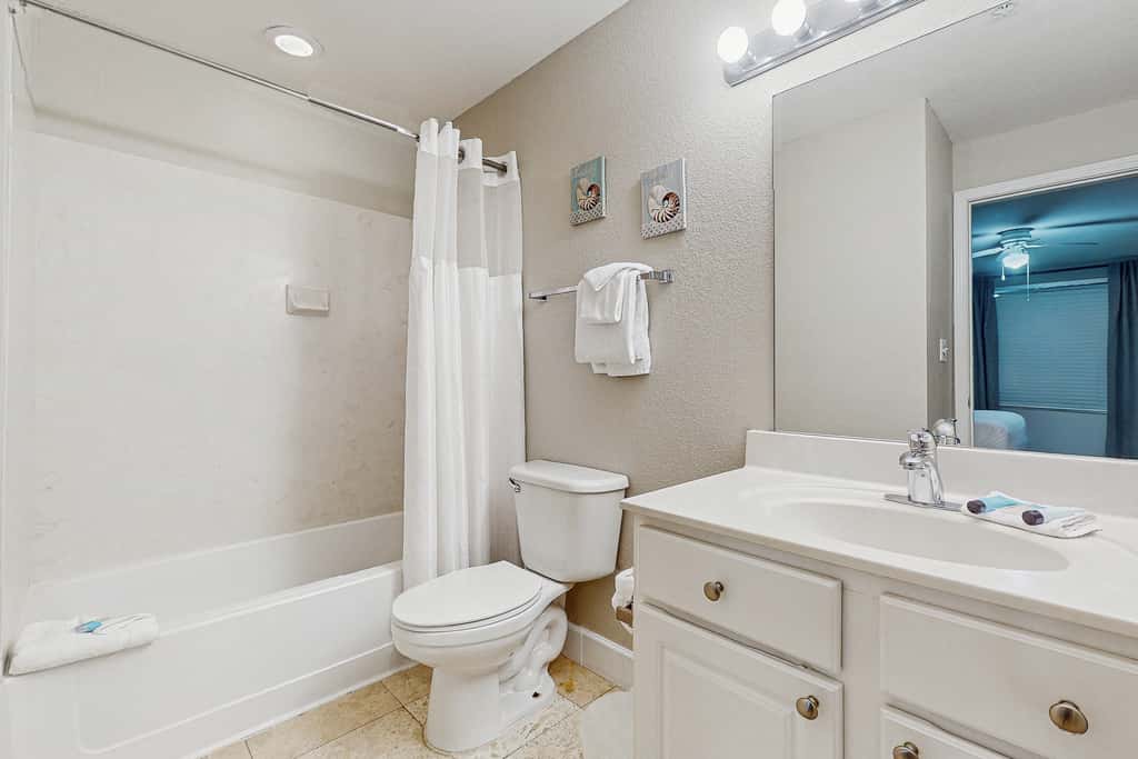 Escape to this waterfront condo with shared pools, a gym, & easy beach access