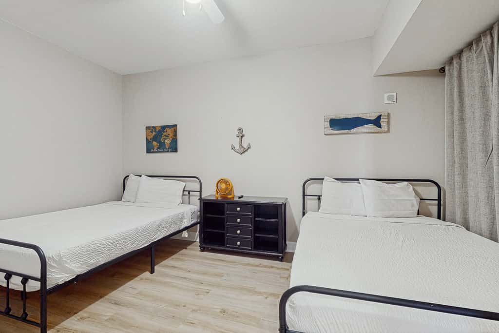 Escape to this waterfront condo with shared pools, a gym, & easy beach access