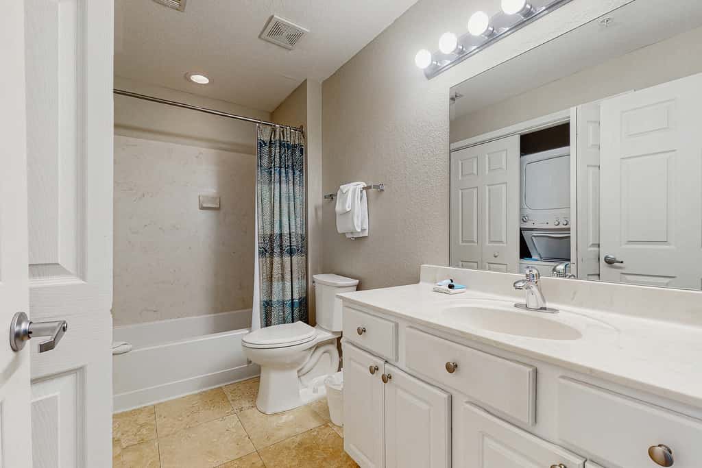 Escape to this waterfront condo with shared pools, a gym, & easy beach access