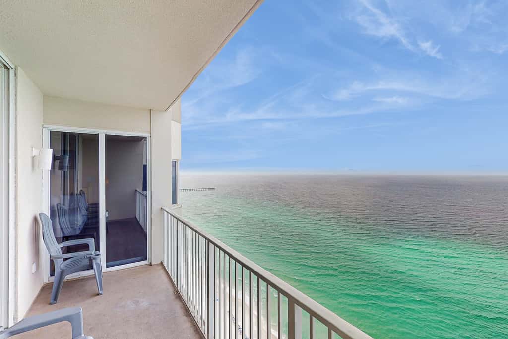 Escape to this waterfront condo with shared pools, a gym, & easy beach access