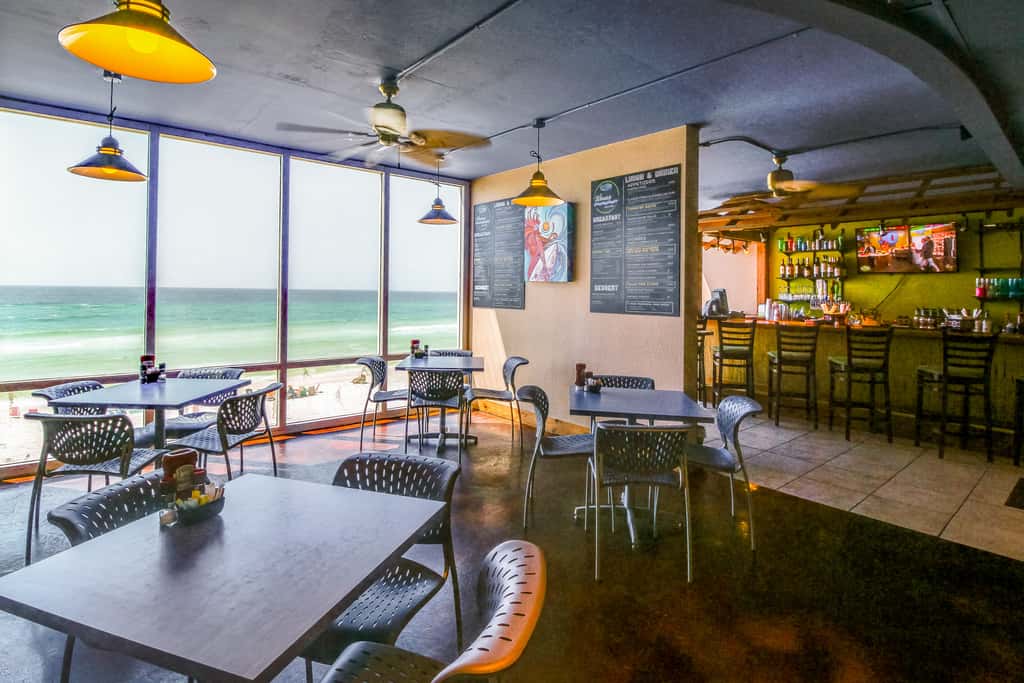 Escape to this waterfront condo with shared pools, a gym, & easy beach access