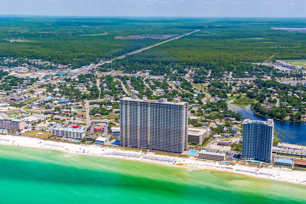 Escape to this waterfront condo with shared pools, a gym, & easy beach access