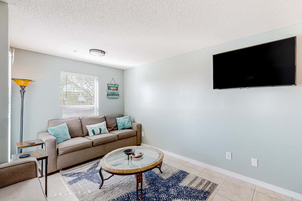 Sunny coastal condo with pool, balcony & sound view - walk to the beach
