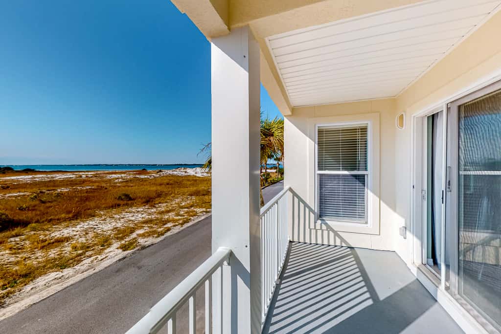 Sunny coastal condo with pool, balcony & sound view - walk to the beach