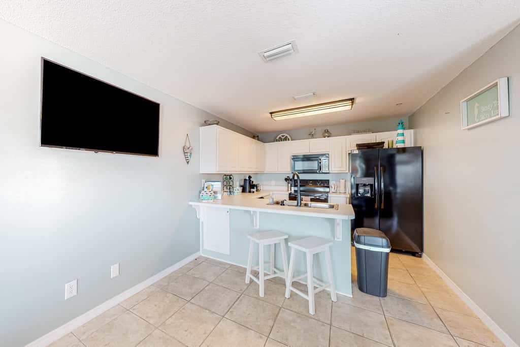 Sunny coastal condo with pool, balcony & sound view - walk to the beach