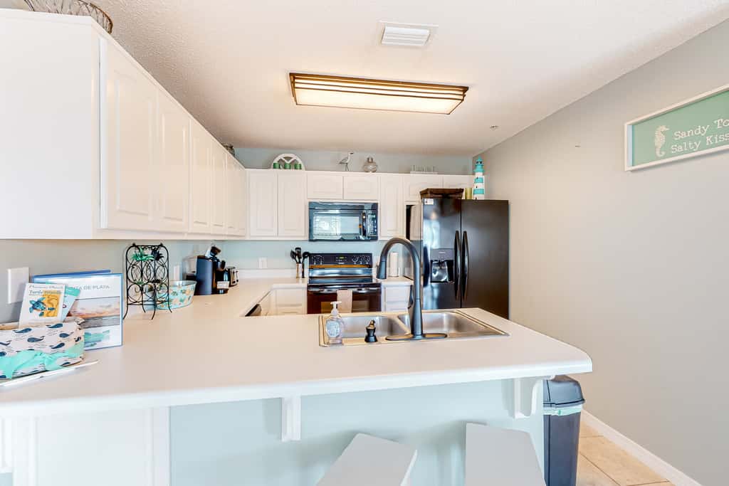 Sunny coastal condo with pool, balcony & sound view - walk to the beach