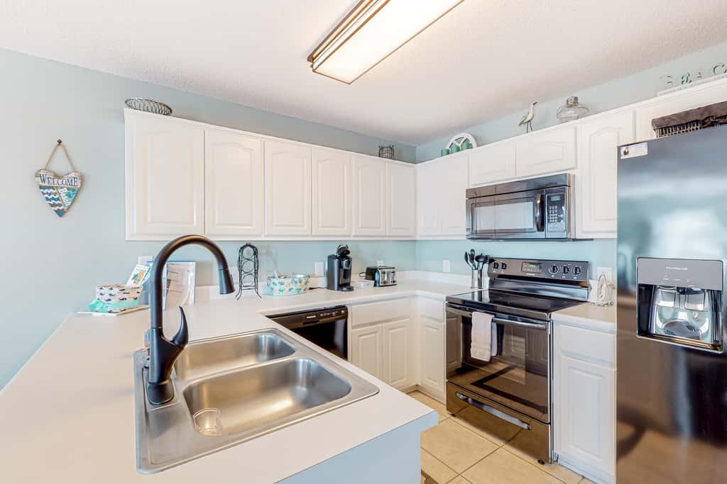 Sunny coastal condo with pool, balcony & sound view - walk to the beach