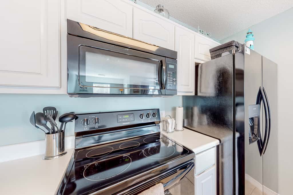 Sunny coastal condo with pool, balcony & sound view - walk to the beach