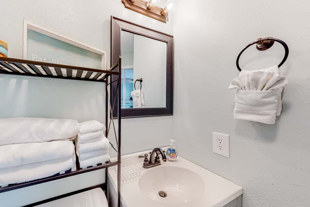 Sunny coastal condo with pool, balcony & sound view - walk to the beach