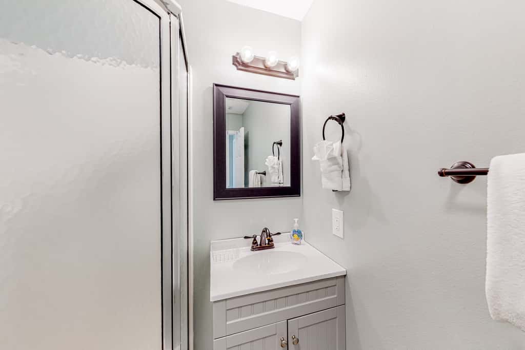 Sunny coastal condo with pool, balcony & sound view - walk to the beach