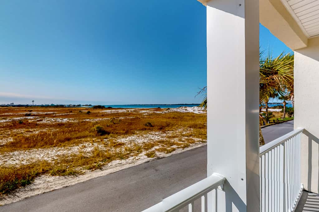 Sunny coastal condo with pool, balcony & sound view - walk to the beach