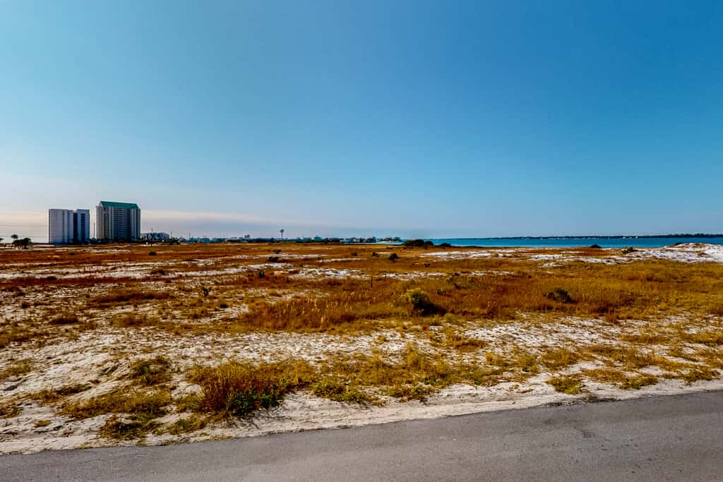 Sunny coastal condo with pool, balcony & sound view - walk to the beach