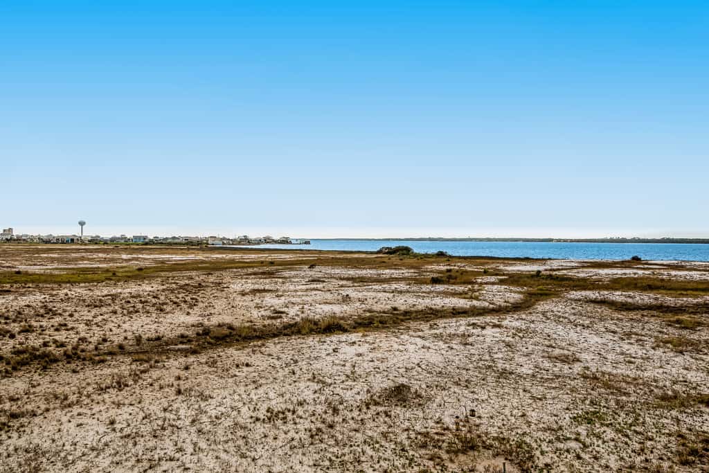 Sunny coastal condo with pool, balcony & sound view - walk to the beach