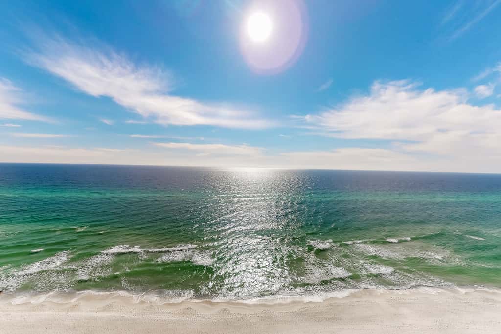 Gulf-facing condo with pool, scenic balcony, beach service & beach access