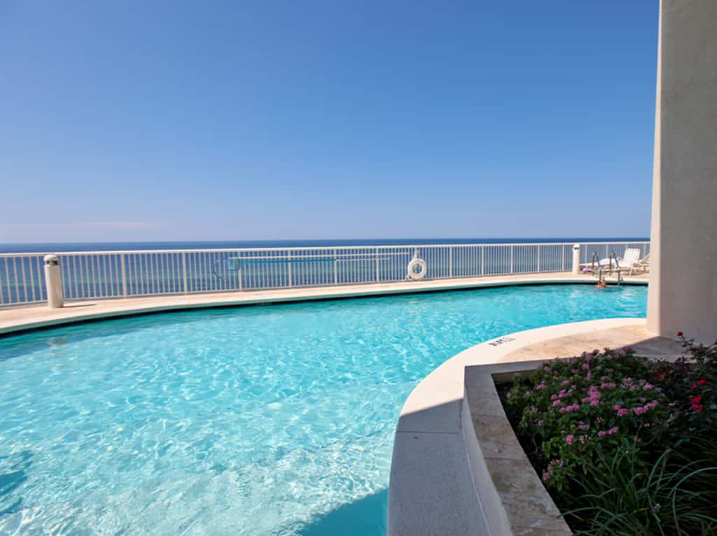 Gulf-facing condo with pool, scenic balcony, beach service & beach access