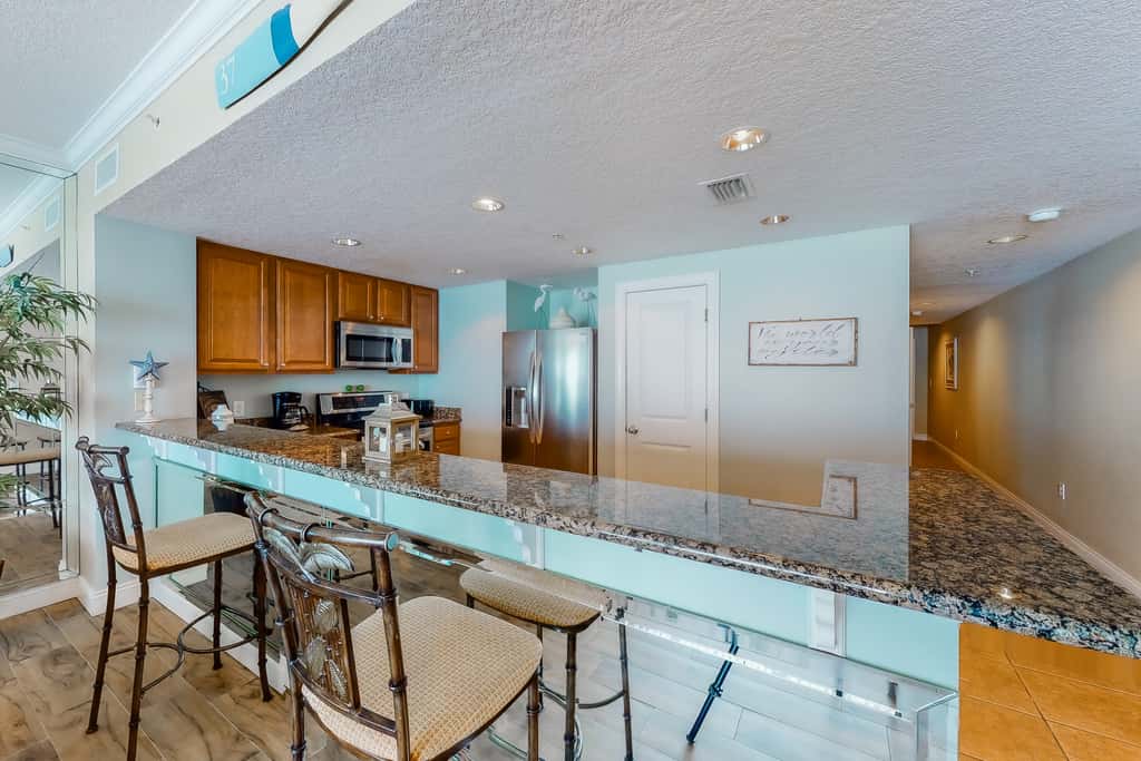 Gulf-facing condo with pool, scenic balcony, beach service & beach access