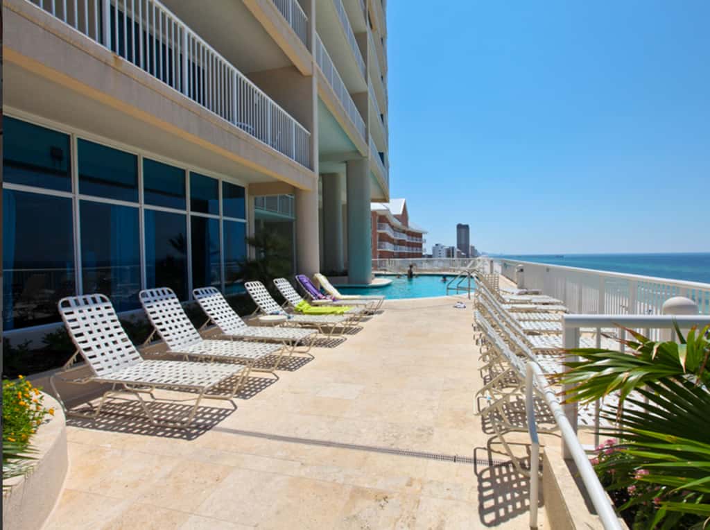 Gulf-facing condo with pool, scenic balcony, beach service & beach access