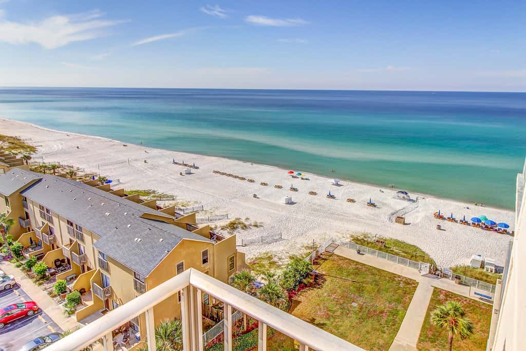 Beachfront condo with ocean-view balcony, pools, hot tub, gym, central AC, & WD