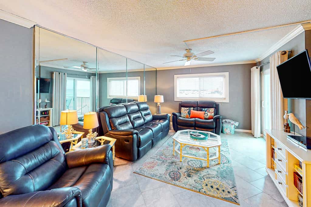 Beachfront condo with ocean-view balcony, pools, hot tub, gym, central AC, & WD
