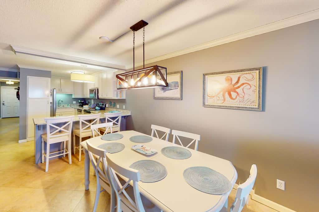 Beachfront condo with ocean-view balcony, pools, hot tub, gym, central AC, & WD