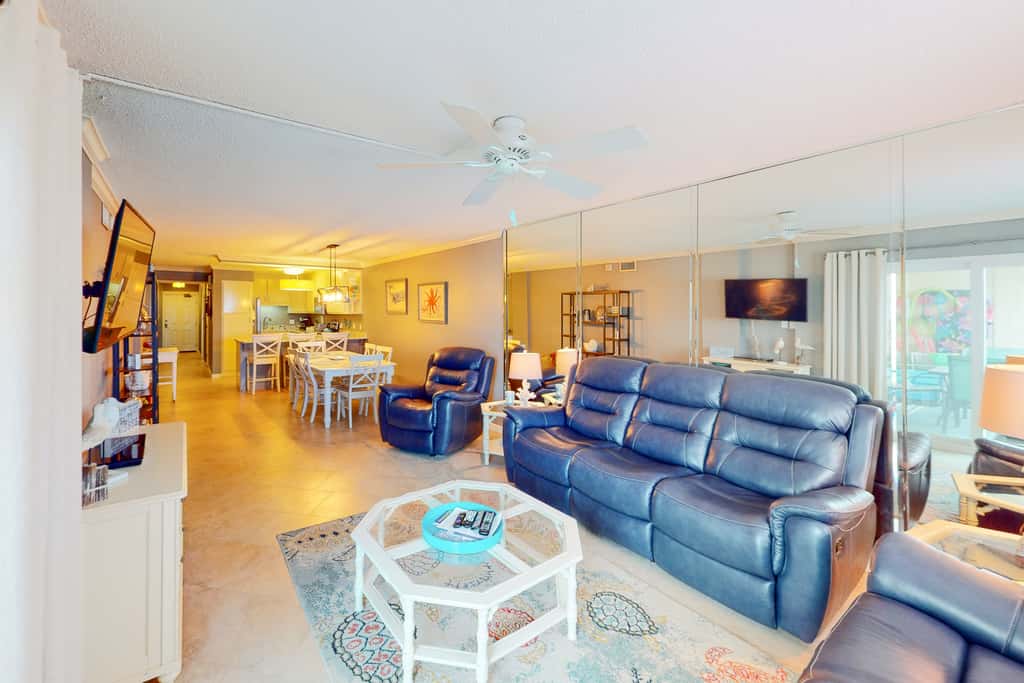 Beachfront condo with ocean-view balcony, pools, hot tub, gym, central AC, & WD