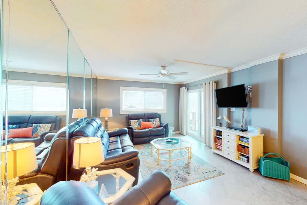 Beachfront condo with ocean-view balcony, pools, hot tub, gym, central AC, & WD
