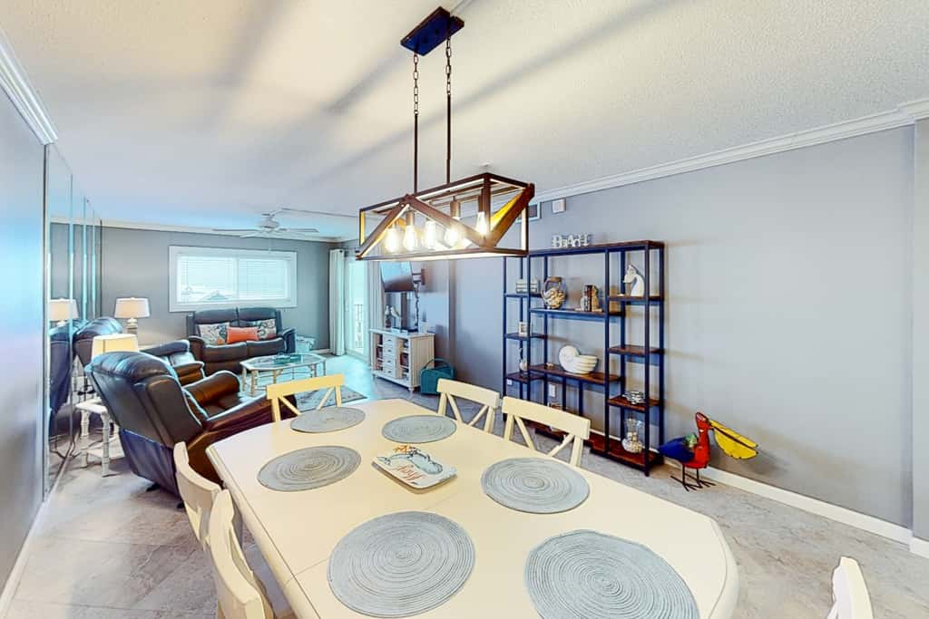 Beachfront condo with ocean-view balcony, pools, hot tub, gym, central AC, & WD