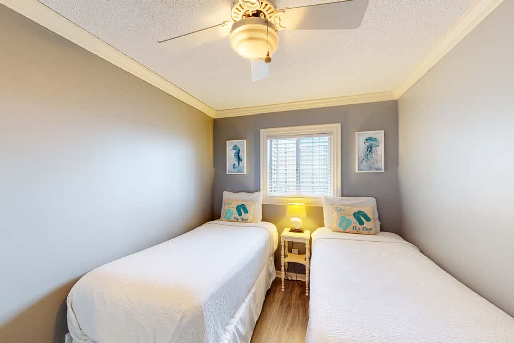 Beachfront condo with ocean-view balcony, pools, hot tub, gym, central AC, & WD