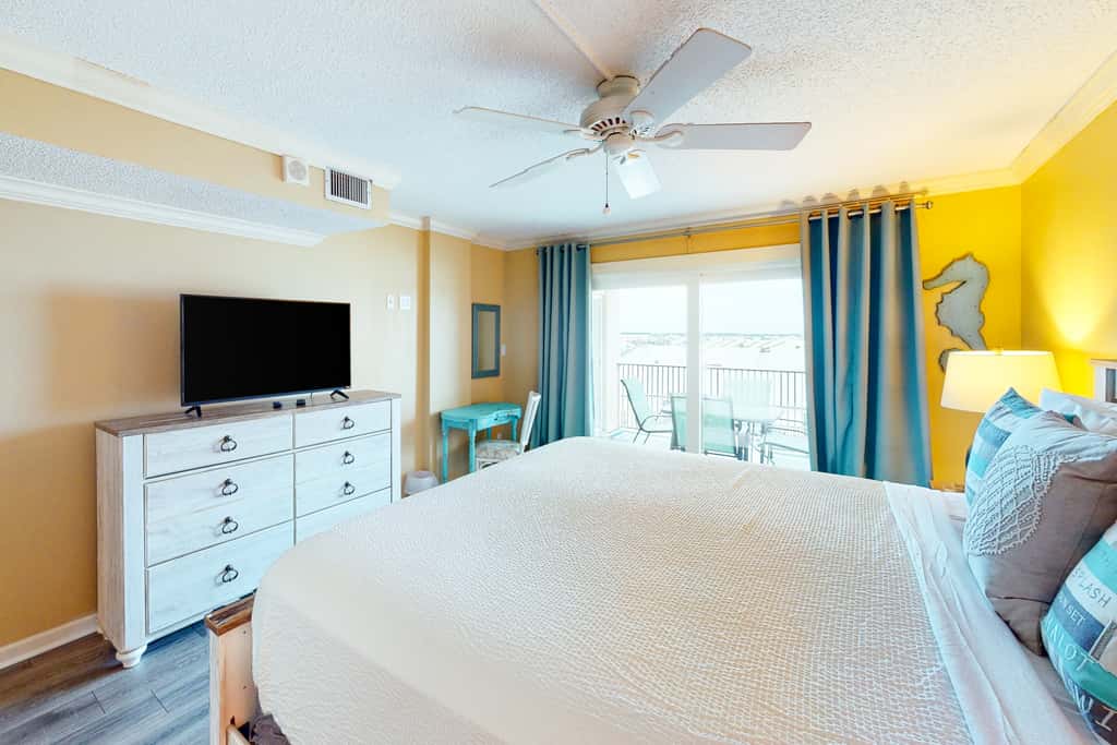 Beachfront condo with ocean-view balcony, pools, hot tub, gym, central AC, & WD
