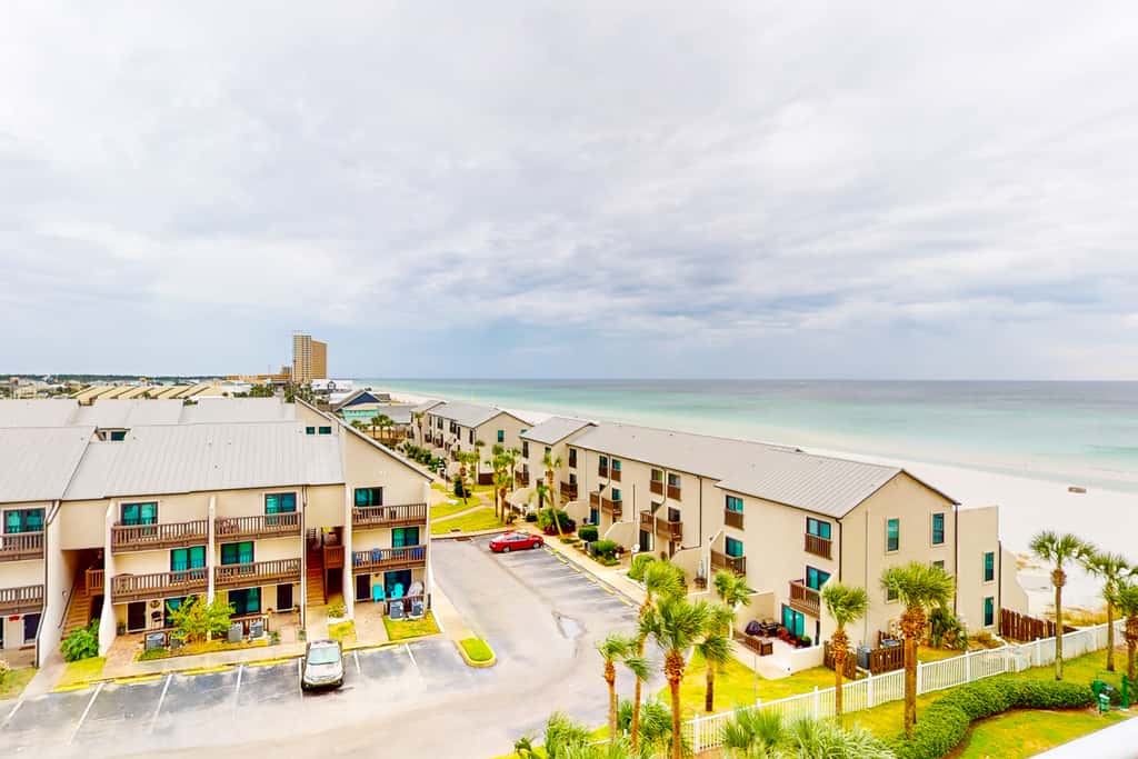 Beachfront condo with ocean-view balcony, pools, hot tub, gym, central AC, & WD
