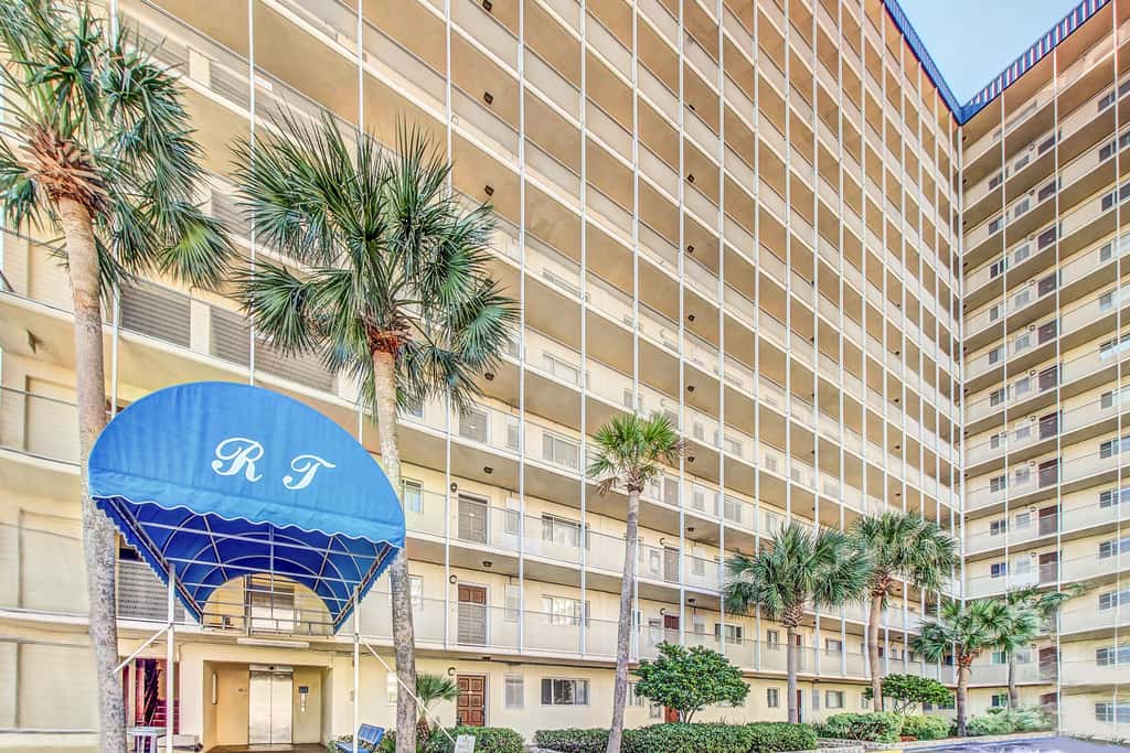 Beachfront condo with ocean-view balcony, pools, hot tub, gym, central AC, & WD