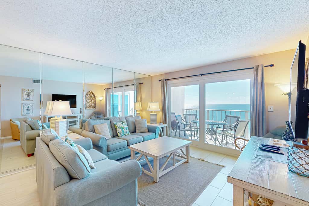 Stunning beachfront condo w/ beach access, shared pool, & private balcony