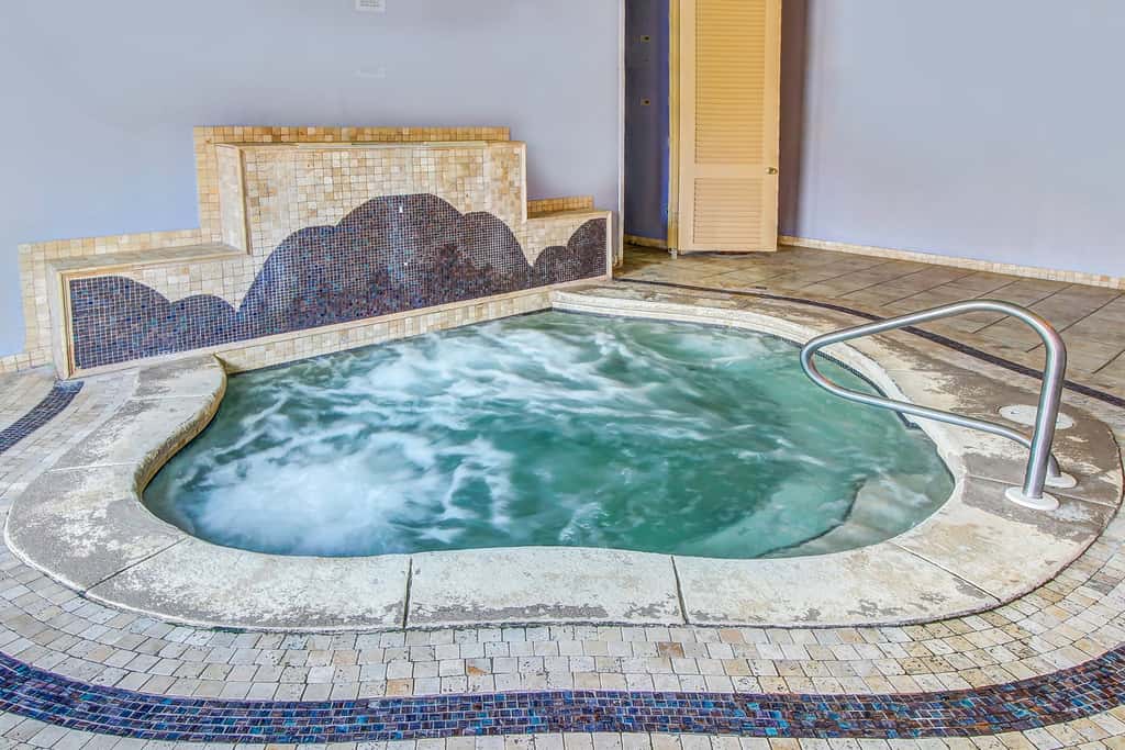 Stunning beachfront condo w/ beach access, shared pool, & private balcony