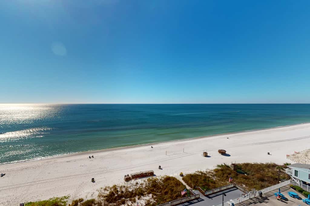 Stunning beachfront condo w/ beach access, shared pool, & private balcony